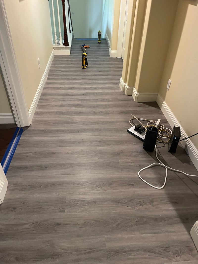 Upstairs hallway with new gray wood-look vinyl plank flooring