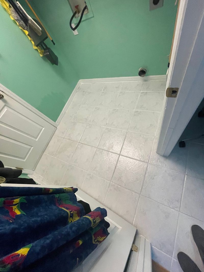 Laundry room with old light gray ceramic tile floor