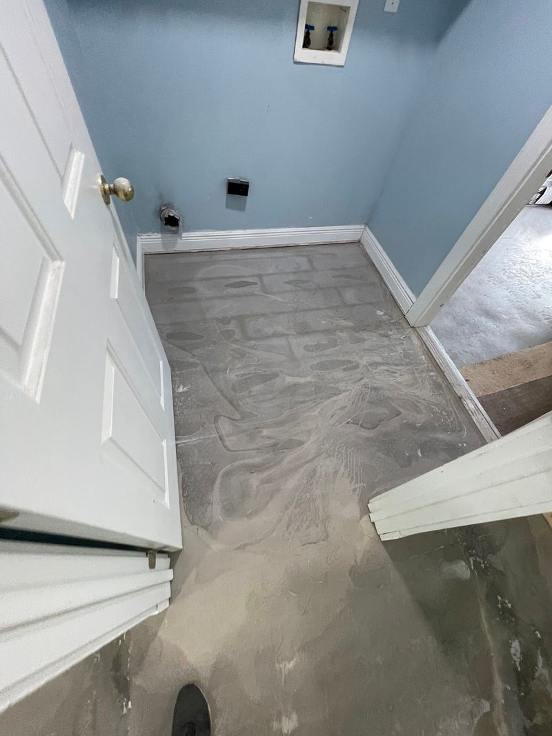 Laundry room slab cleared and patched before new flooring